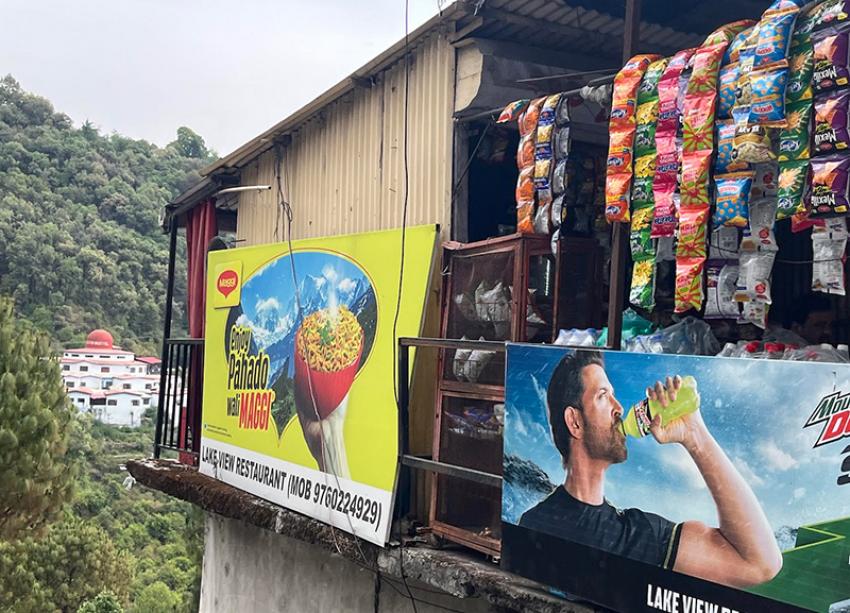 On winding hill roads, Maggi signs appear like small promises of warmth. Photo: Sujoy Dhar