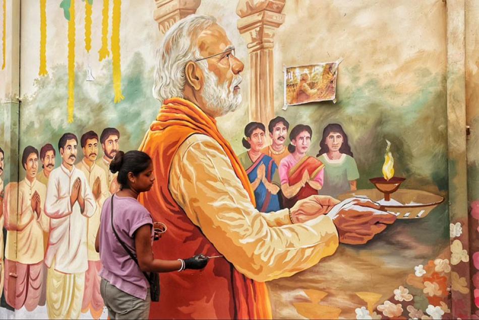 In Images: Kolkata&rsquo;s Chorebagan Sarbojonin unveils wall painting of PM Modi performing aarti to Goddess Durga