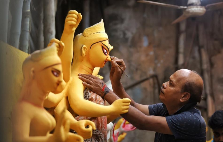 Durga Puja artisans give final touches to idols as Kolkata gears up for the festivities