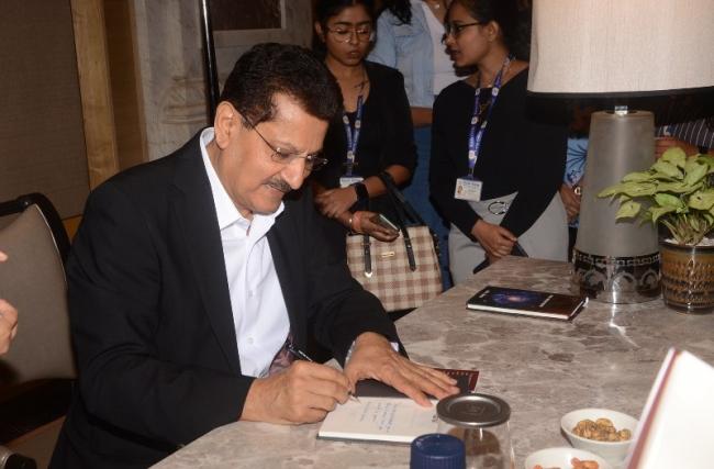 Author and managing director of Baidyanath signing off copies of his book.