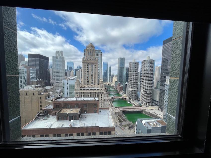 A suite with a view of the Chicago skyline and the emerald waterway on the occasion of St. Patrick